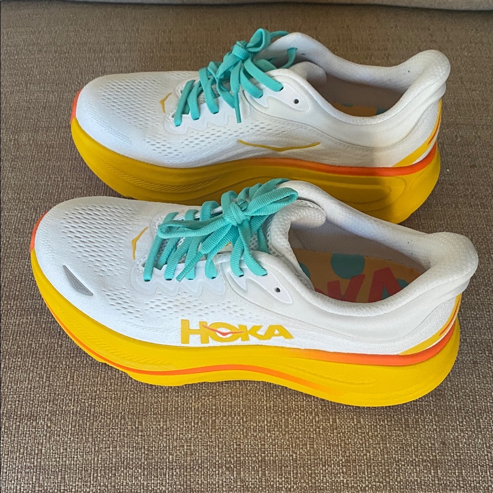Hoka White and Yellow Athletic Shoes with Teal Accents